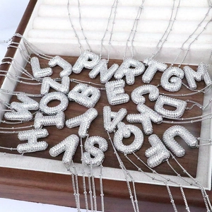 3D bubble alphabet necklaces with pavé zircon stones on a white gold plated base