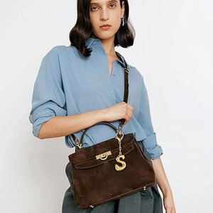 Brown suede leather Kelly style handbag with gold S-letter pendant and top handle