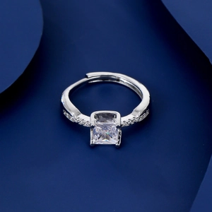 Silver bull-head ring with square zircon and adjustable band on blue background