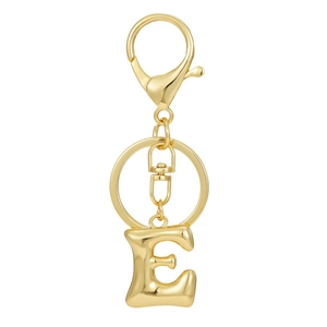 Close-up detail of golden letter E keychain pendant with 18K gold plated metal texture