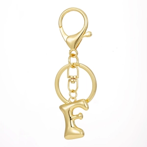 Detail view of 18K gold plated letter F keychain with lobster clasp and metallic shine