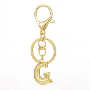 Detailed view of gold plated 3D letter G keychain pendant with lobster clasp and flat ring