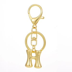 Close-up of gold 18K plated 26 letter H keychain with lobster clasp and metal ring