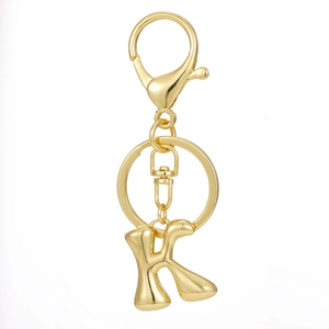 Detailed close-up of 18K gold plated letter K keychain with sturdy lobster clasp and ring