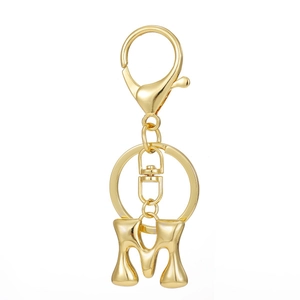 Detailed macro view of 18K gold plated letter M keychain with lobster clasp