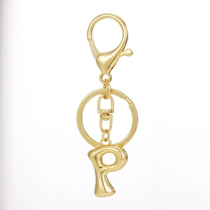 Detail of 18K gold plated letter P pendant with secure lobster clasp on keychain