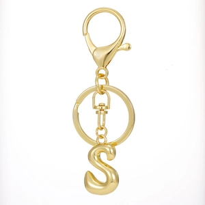 Close-up of 18K gold plated letter S keychain with lobster clasp and metal ring