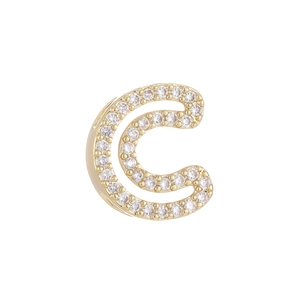 Detail of a 18k gold plated bubble letter C pendant with sparkling white zircon inlay