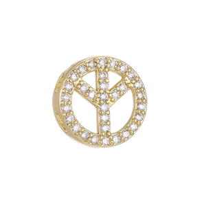 Macro shot of 18k gold plated S925 silver peace sign charm with pavé cubic zirconia