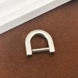 Close-up of polished stainless steel D-ring with removable screw bar for luggage repair