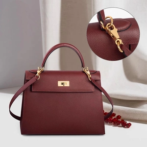 Burgundy Epsom leather trapezoid handbag with gold rotating lock and shoulder strap