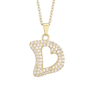 Detailed macro view of the sparkling letter D pendant with gold plating and zircons