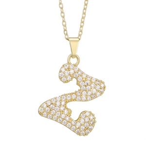Close-up of golden number 2 heart pendant necklace with shimmering pave set cubic zirconia