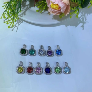 Detailed grid of eleven colorful octagonal zircon pendants in elegant halo settings