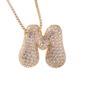 Golden balloon letter M pendant necklace with sparkling cubic zirconia on box chain