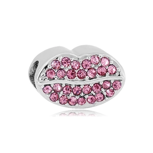 Detailed close-up of pink rhinestone lip charm bead for DIY bracelets in silver-tone metal