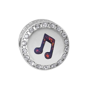 Macro view of a silver-tone musical note charm with purple glitter and pavé crystals