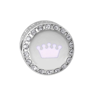 Macro detail of silver charm bead with zirconia edges and purple crown design