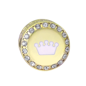Macro detail of a gold crown charm bead with purple center and zircon pavé stones