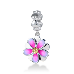Macro detail of S925 sterling silver flower charm with pink gradient enamel and golden core
