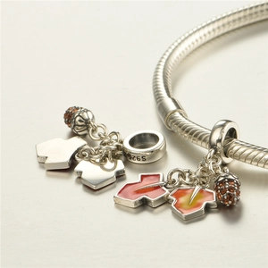 S925 sterling silver red maple leaf and pine cone charms on a snake chain bracelet
