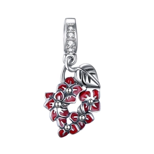 Macro detail of S925 sterling silver red enamel flower charm with sparkling zircons