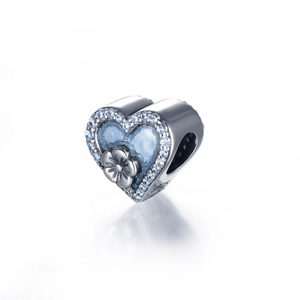 Charm cuore in argento S925 con smalto blu, dettaglio floreale e pietre di zircone