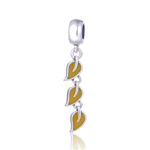 Macro view of S925 sterling silver triple leaf pendants with yellow enamel finish