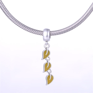 Close-up of S925 sterling silver botanical leaf pendant with yellow enamel inlay