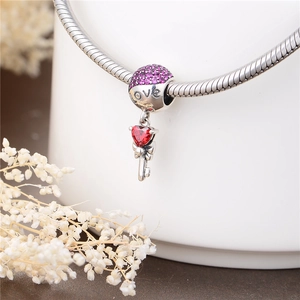 S925 sterling silver heart key charm with pink crystals on a snake chain bracelet