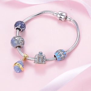 S925 zilveren slangenarmband met kasteelhanger en blauwe pavé-gezette kralen