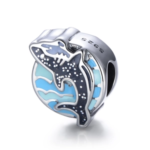 Detailed view of S925 sterling silver whale shark charm with blue enamel ocean waves
