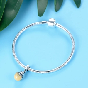 S925 sterling silver sister egg charm bead on a snake chain bracelet with green leaf accents