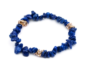 Detailed macro view of natural blue stone beads with gold crystal spacer charms
