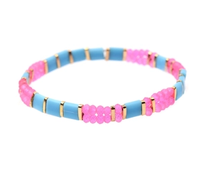 Detail view of colorful Miyuki Tila beads and pink faceted crystals on a bohemian bracelet