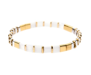 Detail of Miyuki Tila bead bracelet with white and gold geometric enamel tiles
