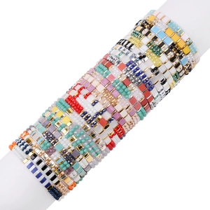 Handmade colorful Miyuki Tila tile bead stretch bracelets in bohemian stacked style