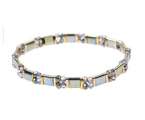 Detailed macro view of Miyuki Tila beads with dark gray and purple faceted glass accents