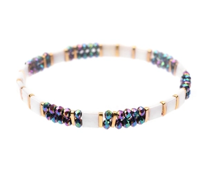 Detail of Miyuki Tila bead bracelet with white enamel squares and colorful faceted beads