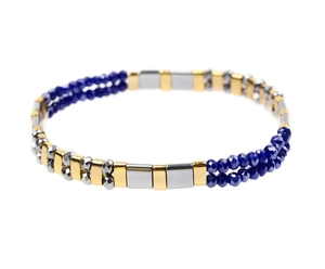 Macro detail of Tila bead bracelet featuring blue faceted beads and metallic spacer beads