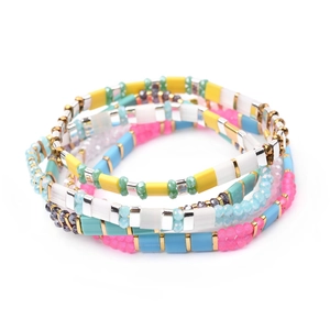 Vibrant handmade colorful Tila and Miyuki bead stackable bracelet set for summer fashion.