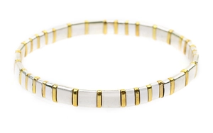Detail of silver square blocks and gold spacer beads in a minimalist geometric bracelet