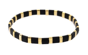 Detailed close-up of handmade Miyuki Tila bead bracelet with black matte and gold tiles