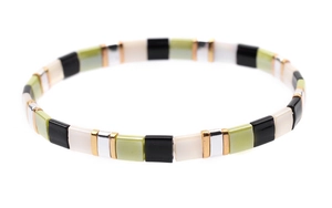 Detail of multi-color elastic Tila bead bracelet with black, white and green square beads