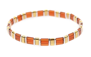 Detail of amber translucent Tila beads and metallic spacers on tile style bracelet