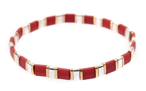 Detail of handmade Tila bead bracelet with red, gold, and silver rectangular enamel tiles