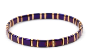 Detailed close-up of dark purple Tila beads with golden spacers on a stretch bracelet