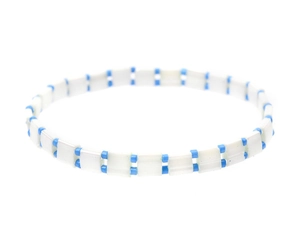 Detailed view of woven Tila beads bracelet with white rectangular tiles and blue accents