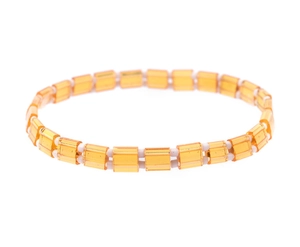 Detail of orange translucent Tila beads and white round beads on a woven bracelet