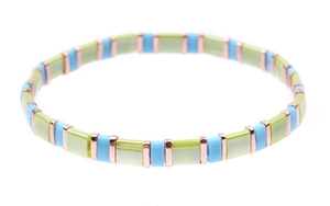 Close-up of handmade Tila bead bracelet with green, blue, and rose gold square beads
